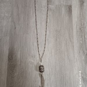 Long silver tassle pendant necklace